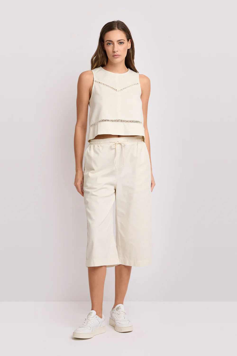 Top cropped con inserti traforati Kocca